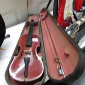 An old German copy of an Antonius Stradivarius violin with bow and in hard wood case.