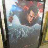 A Superman poster, framed.