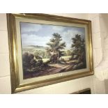 A landscape in gilt frame