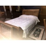 A wooden bedstead (mattress not included)