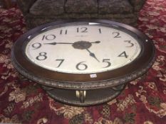 An unusual metal table with a large clock face as top ****Condition report**** The