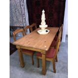 A pine table and 6 chairs