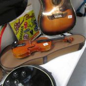 A good quality Chinese violin in cloth covered hard case.