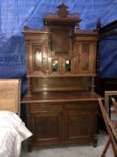 A fabulous Edwardian mahogany buffet with Art Nouveau style doors and leaded glass panels