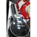 A 1970s Kay K-3 Les Paul style electric guitar with hard case.