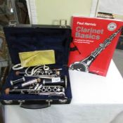 A Blessing clarinet in case with 2 tutor guides.