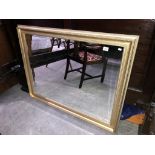 A gilt framed mirror