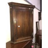 A hanging corner cabinet