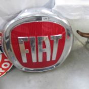 A large Fiat showroom sign.