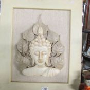 A framed carved wood Indian deity portrait relief, frame 50 x 61 cm.