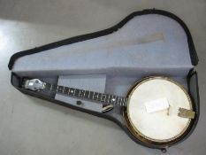 A vintage Jetel banjo in case