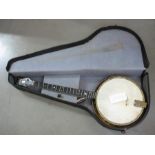 A vintage Jetel banjo in case