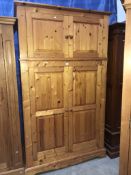 A pine double wardrobe with top cabinet