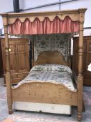 A pine 4 poster bed (mattress not included)