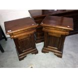 A pair of antique bedside cabinets