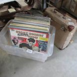 A mixed lot of LP records and an empty LP record case.