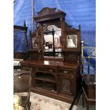 A mirror backed buffet cabinet