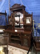 A mirror backed buffet cabinet
