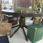 A cartwheel coffee table with glass top, 74 cm diameter.