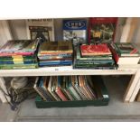 2 shelves of books on trains