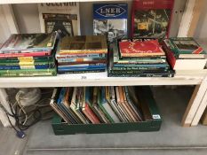 2 shelves of books on trains