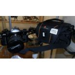 A Canon A7 single lens reflex film camera with a Tamron 35-70 zoom lens,