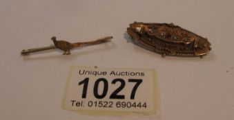 A Victorian gold brooch and one other.