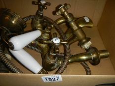 A set of vintage brass bath taps.