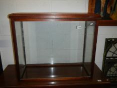 A large mahogany framed display cabinet