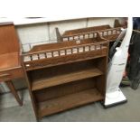 A matching pair of oak wall hanging book shelves