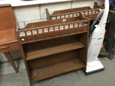 A matching pair of oak wall hanging book shelves