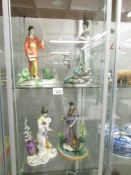 4 manabu Saito Malaysian porcelain figurines, a/f.