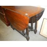 A 1930's oak gate leg table.