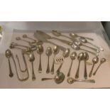 26 items of silver including sugar nips, teaspoons etc., approximately 440 grams.