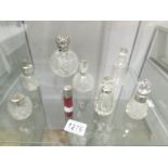 A mixed lot of silver topped bottles including cranberry example.