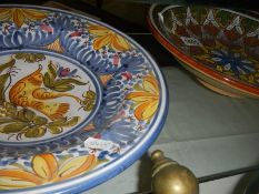 2 large continental pottery dishes.