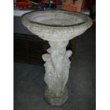 A stone bird bath