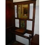 A 19th/20th century oak hall stand with art nouveau leaded glass panel