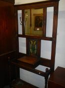 A 19th/20th century oak hall stand with art nouveau leaded glass panel