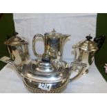 A silver plate teapot and 3 silver plate hot water jugs.