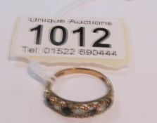 A 9ct gold sapphire and gem set ring, size N (missing one stone).