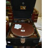 An HMV picnic gramaphone (missing handle).