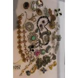 A mixed lot of vintage jewellery including silver bracelet, brooches etc approximately 30 items.