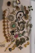 A mixed lot of vintage jewellery including silver bracelet, brooches etc approximately 30 items.