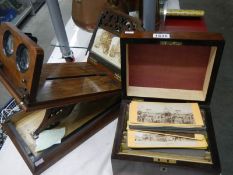 A Victorian stereoscope viewer with 120 cards in box with bone label 'The Stereoscopic Treasury'.