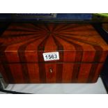 A rosewood and satinwood sunburst design box.