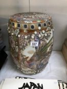 An oriental pottery barrel stool/plant stand