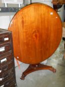 A Victorian mahogany tip up dining table