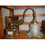 A hand oil lamp and a wall light.