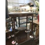 An Edwardian mahogany oval side table